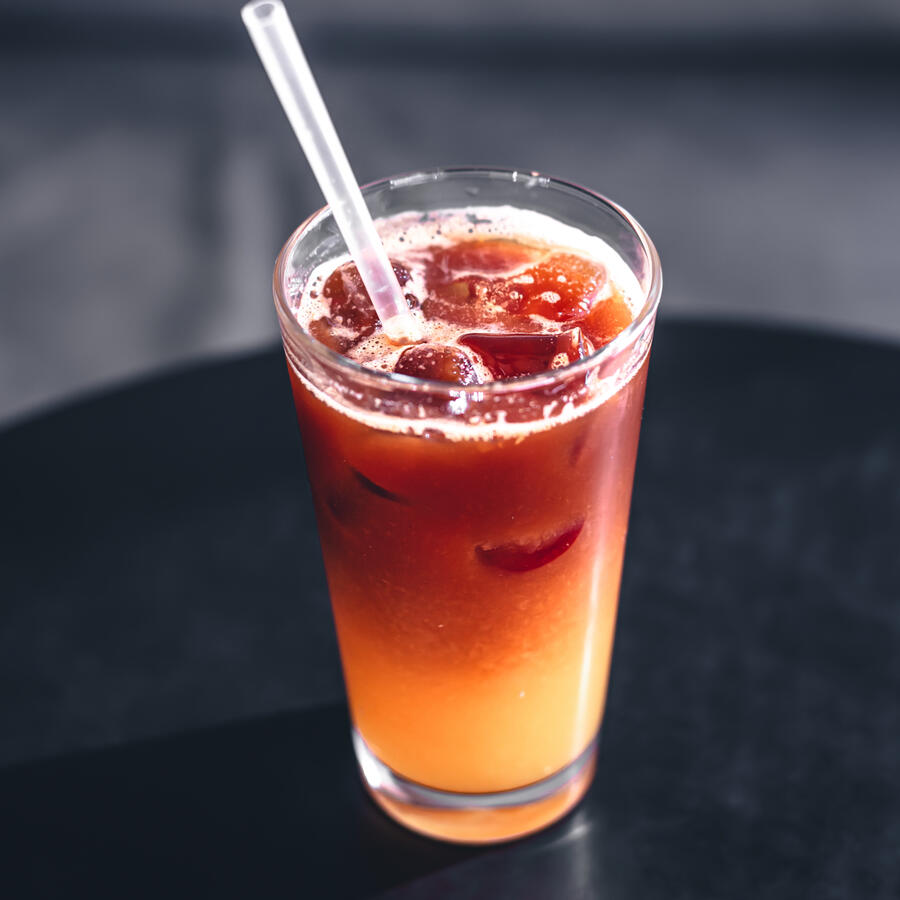 Kugane Iced Tea Five different alcohols, cola, lemon, and the Kugane twist: a splash of dzo milk.